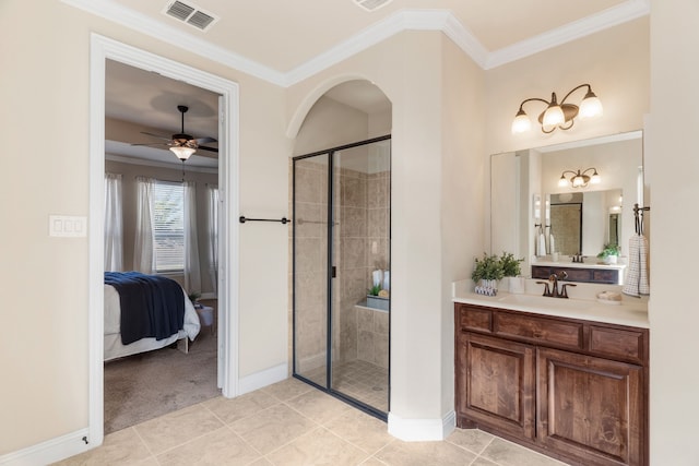 10014 Edgeway Cir, Rowlett, TX 75089 - ensuite bathroom featuring ornamental molding, vanity, a shower stall, baseboards, and tile patterned floors