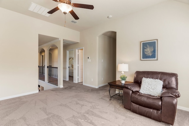 10014 Edgeway Cir, Rowlett, TX 75089 - living area featuring arched walkways, carpet floors, baseboards, and a ceiling fan
