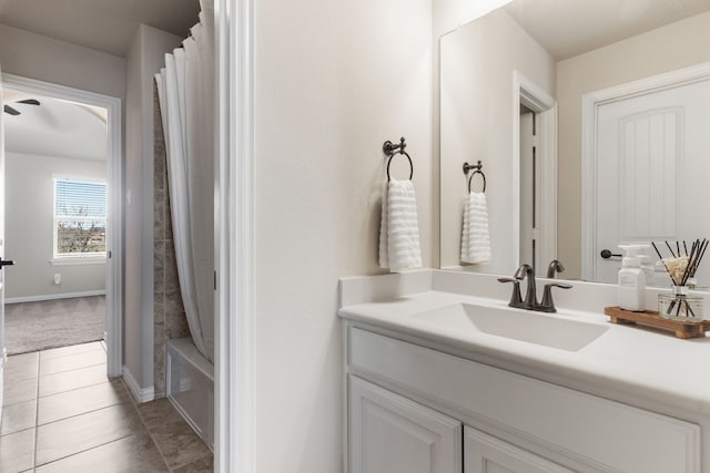 10014 Edgeway Cir, Rowlett, TX 75089 - bathroom with vanity, tile patterned flooring, shower / bath combo with shower curtain, a ceiling fan, and baseboards