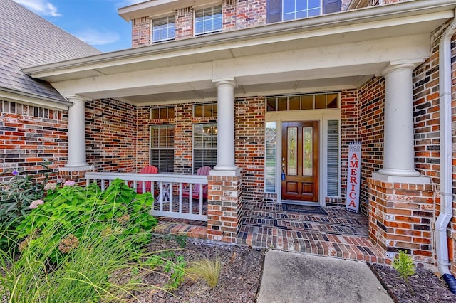 property entrance with covered porch