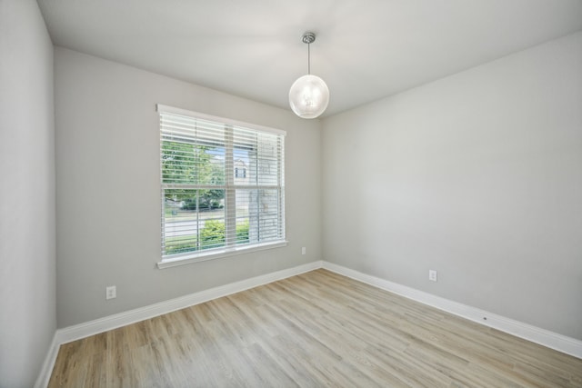 unfurnished room with light hardwood / wood-style flooring