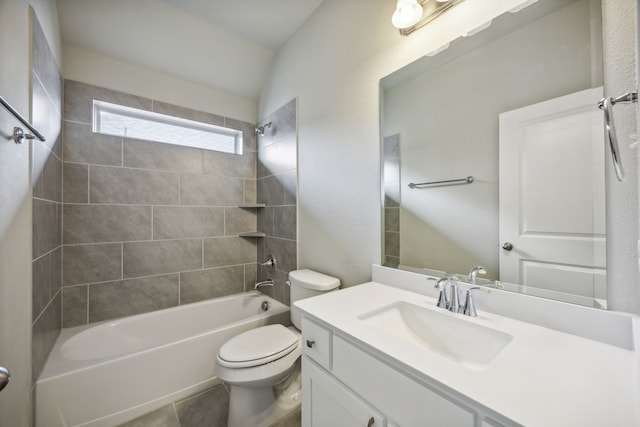 full bathroom featuring vanity, toilet, and tiled shower / bath