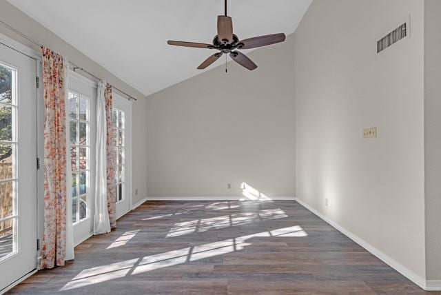 spare room with ceiling fan, dark hardwood / wood-style floors, and lofted ceiling