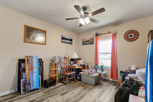 misc room featuring hardwood / wood-style flooring and ceiling fan