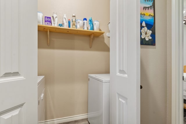 laundry area featuring hardwood / wood-style flooring and independent washer and dryer