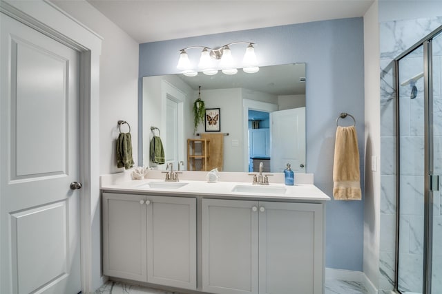 bathroom featuring vanity and a shower with shower door