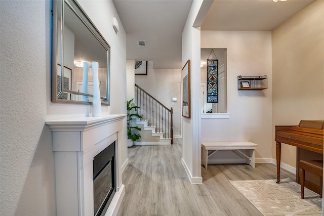 entryway with light hardwood / wood-style floors