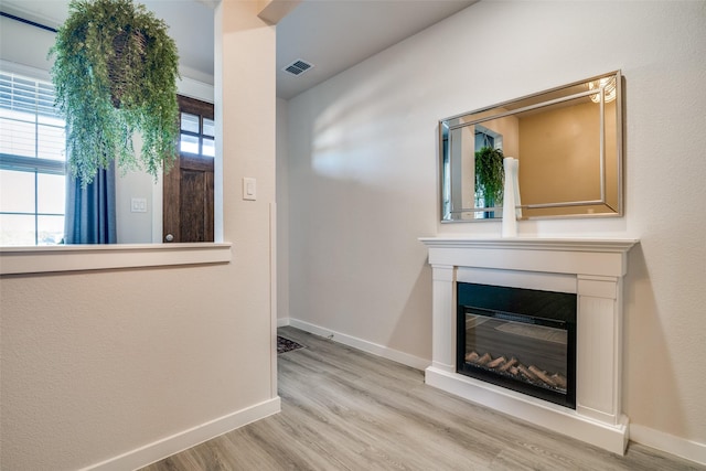 unfurnished living room featuring light hardwood / wood-style floors