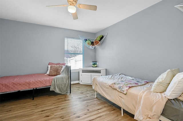 bedroom featuring ceiling fan and light wood-type flooring