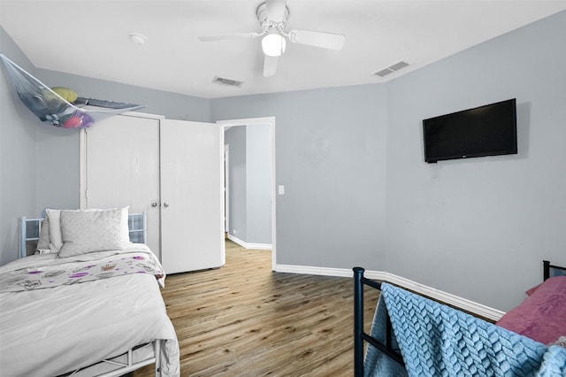 bedroom featuring hardwood / wood-style floors and ceiling fan