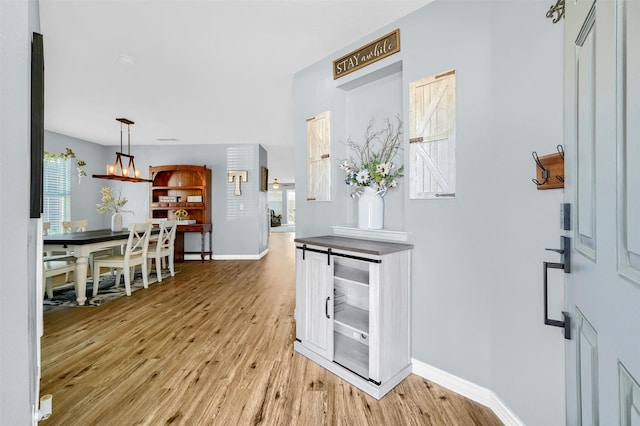 entrance foyer featuring a chandelier and light hardwood / wood-style floors