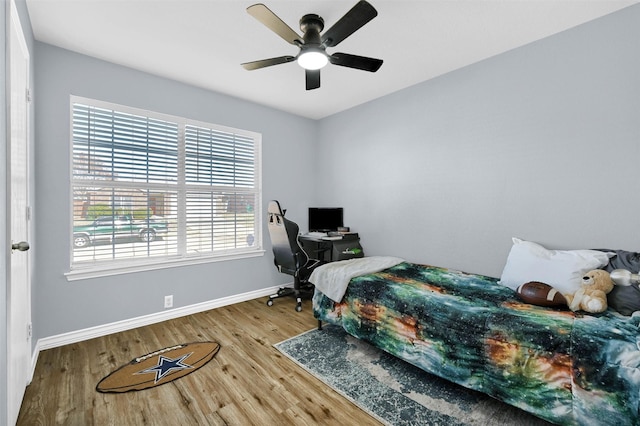 bedroom with hardwood / wood-style flooring and ceiling fan