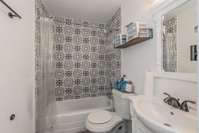 full bathroom with vanity, shower / tub combo, and toilet