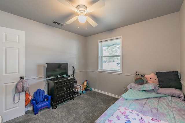 bedroom with ceiling fan and dark carpet