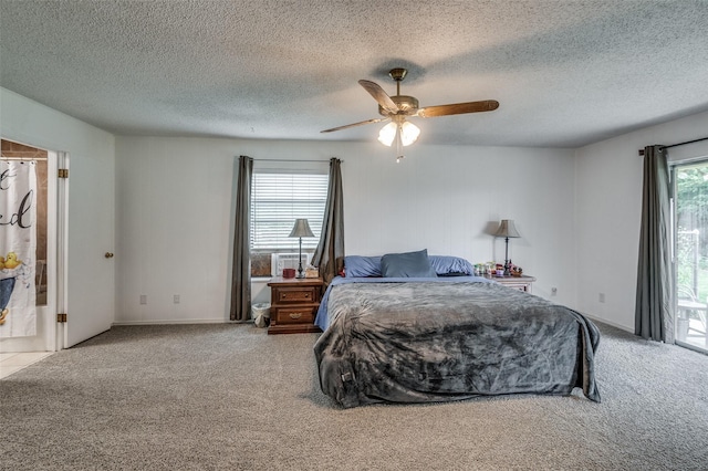 carpeted bedroom featuring multiple windows, ceiling fan, and a textured ceiling