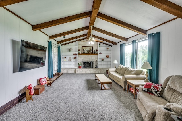 living room with carpet, ceiling fan, vaulted ceiling with beams, built in features, and a fireplace