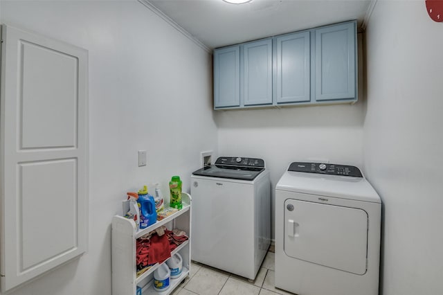 laundry room featuring separate washer and dryer, light tile patterned floors, cabinets, and ornamental molding