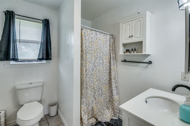 bathroom featuring vanity, tile patterned flooring, a shower with curtain, and toilet