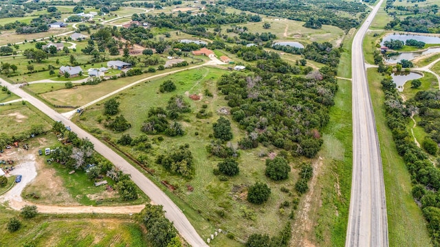 bird's eye view featuring a rural view and a water view