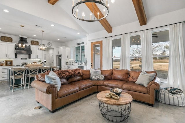 living room featuring an inviting chandelier, high vaulted ceiling, and beamed ceiling