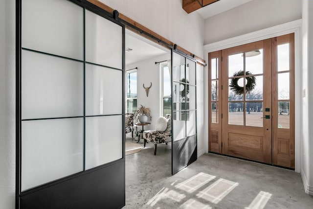 entryway featuring a healthy amount of sunlight and a barn door