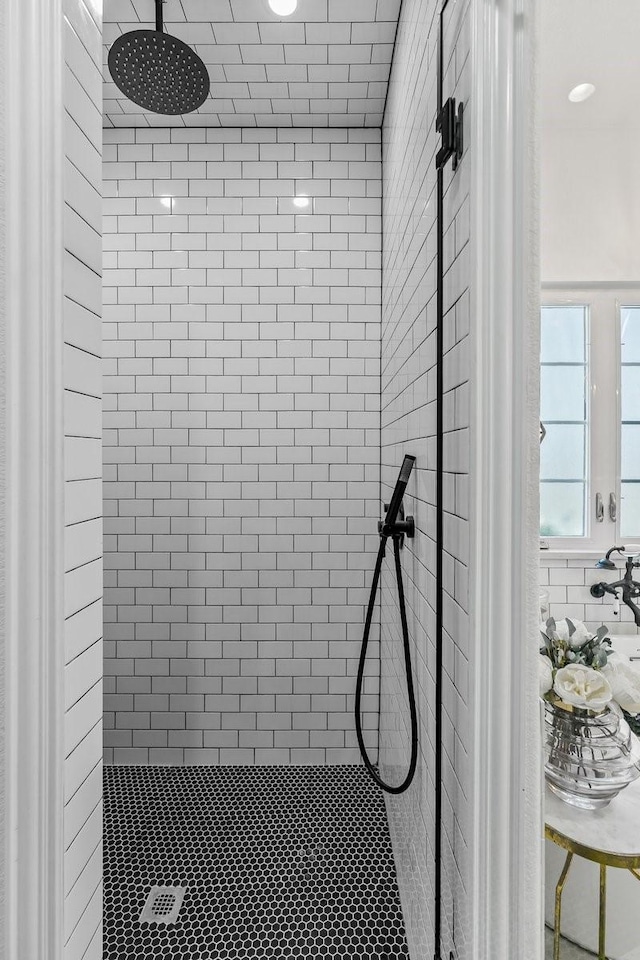 bathroom with a tile shower