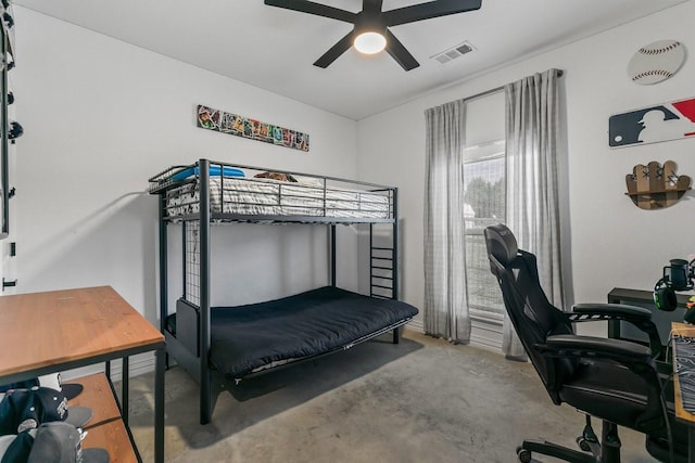 bedroom with ceiling fan and light carpet