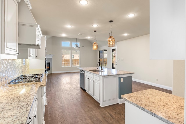 kitchen featuring white cabinetry, sink, an island with sink, and appliances with stainless steel finishes