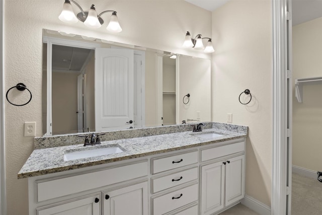 bathroom with vanity and ornamental molding