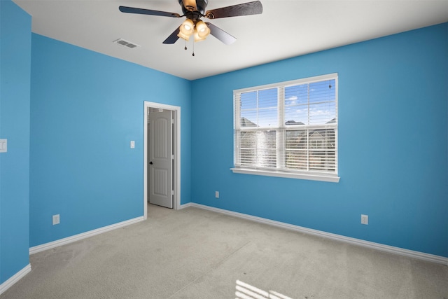 carpeted empty room with ceiling fan