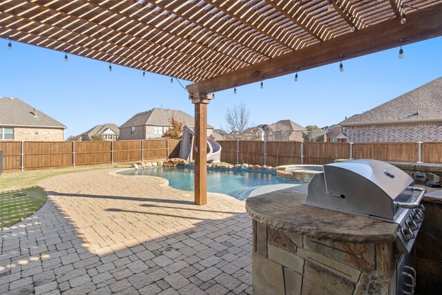 view of pool featuring an in ground hot tub, a pergola, a patio area, and a water slide