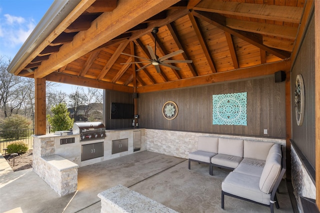view of patio featuring a gazebo, fence, area for grilling, and an outdoor hangout area