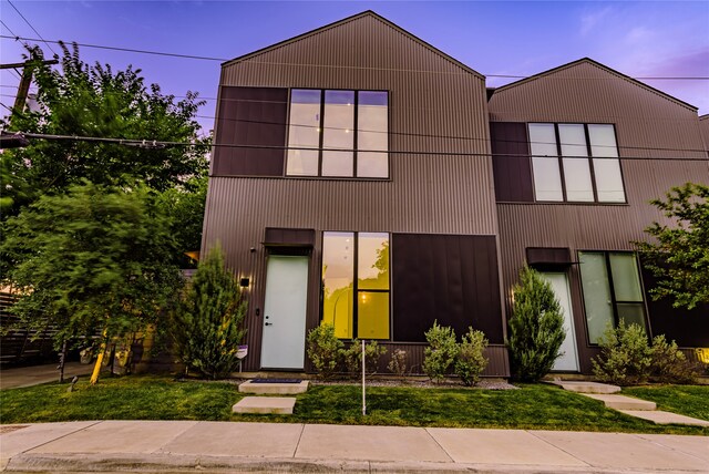 contemporary home featuring a yard