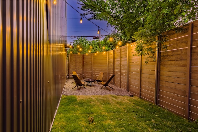 yard at dusk with an outdoor fire pit