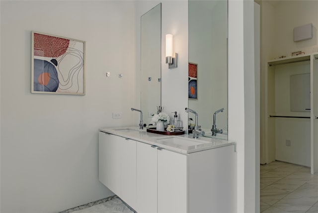 bar featuring sink and white cabinetry