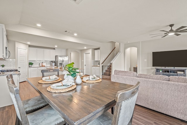 dining room with hardwood / wood-style flooring and ceiling fan