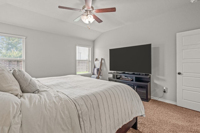 bedroom featuring ceiling fan, light colored carpet, and vaulted ceiling