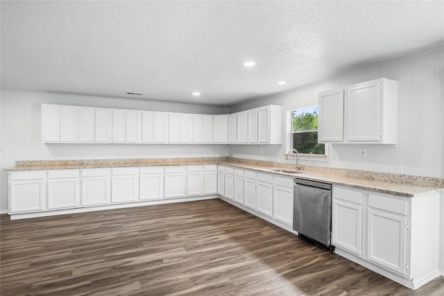 kitchen with sink, white cabinets, and stainless steel dishwasher