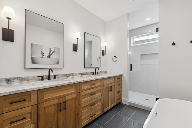 bathroom with tile patterned floors, vanity, and independent shower and bath