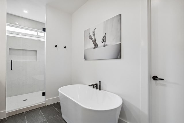 bathroom with shower with separate bathtub and tile patterned floors