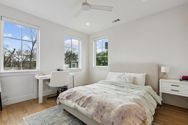 bedroom featuring ceiling fan and light hardwood / wood-style flooring