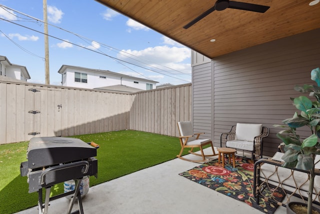 view of patio with a grill and ceiling fan