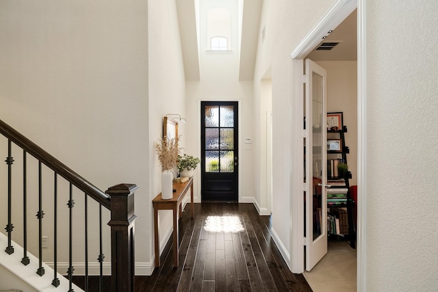 entrance foyer with dark hardwood / wood-style floors