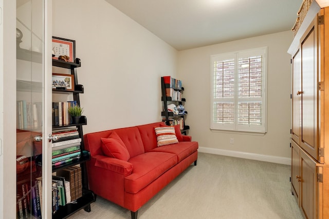 sitting room featuring light colored carpet