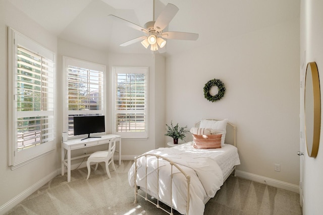 bedroom featuring ceiling fan and carpet