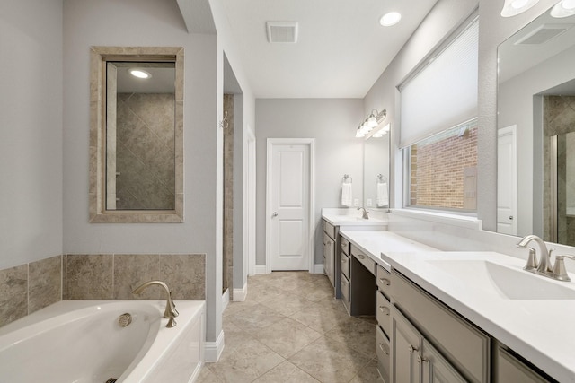 bathroom with vanity and plus walk in shower