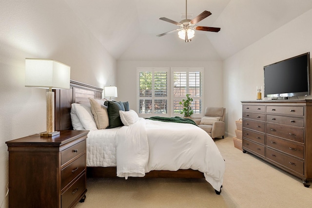 carpeted bedroom with ceiling fan and vaulted ceiling