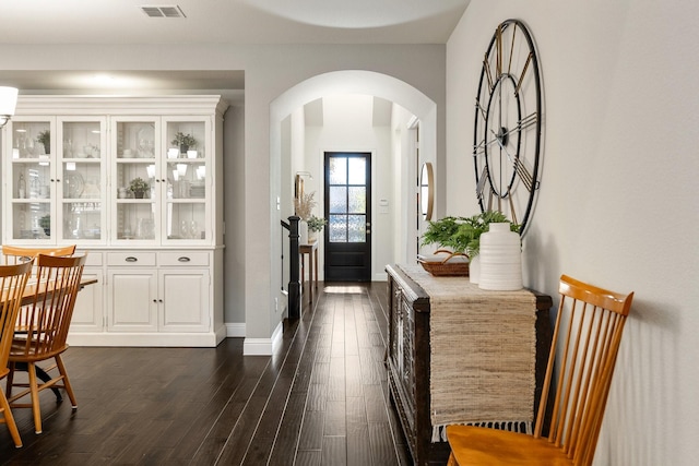 foyer entrance with dark hardwood / wood-style floors