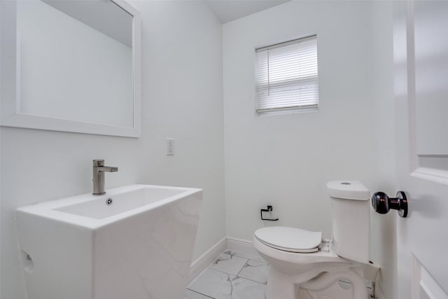 bathroom featuring toilet