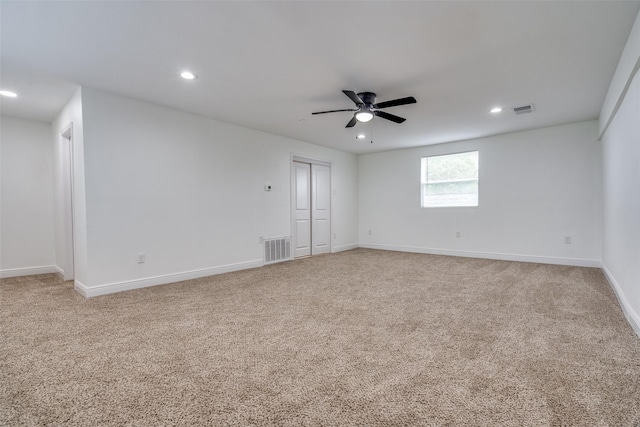 carpeted empty room with ceiling fan